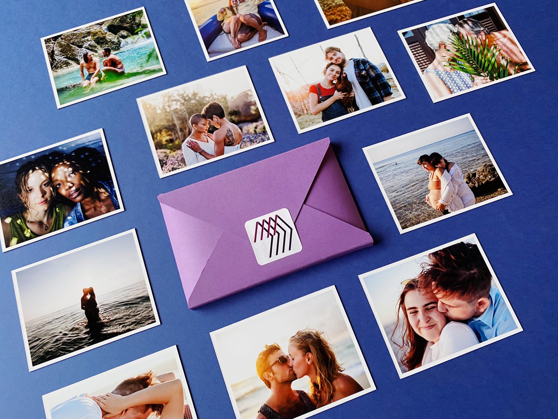 Custom square photo magnets showing couples and family moments, arranged on a blue background with a Magnetic Love envelope in the center.
