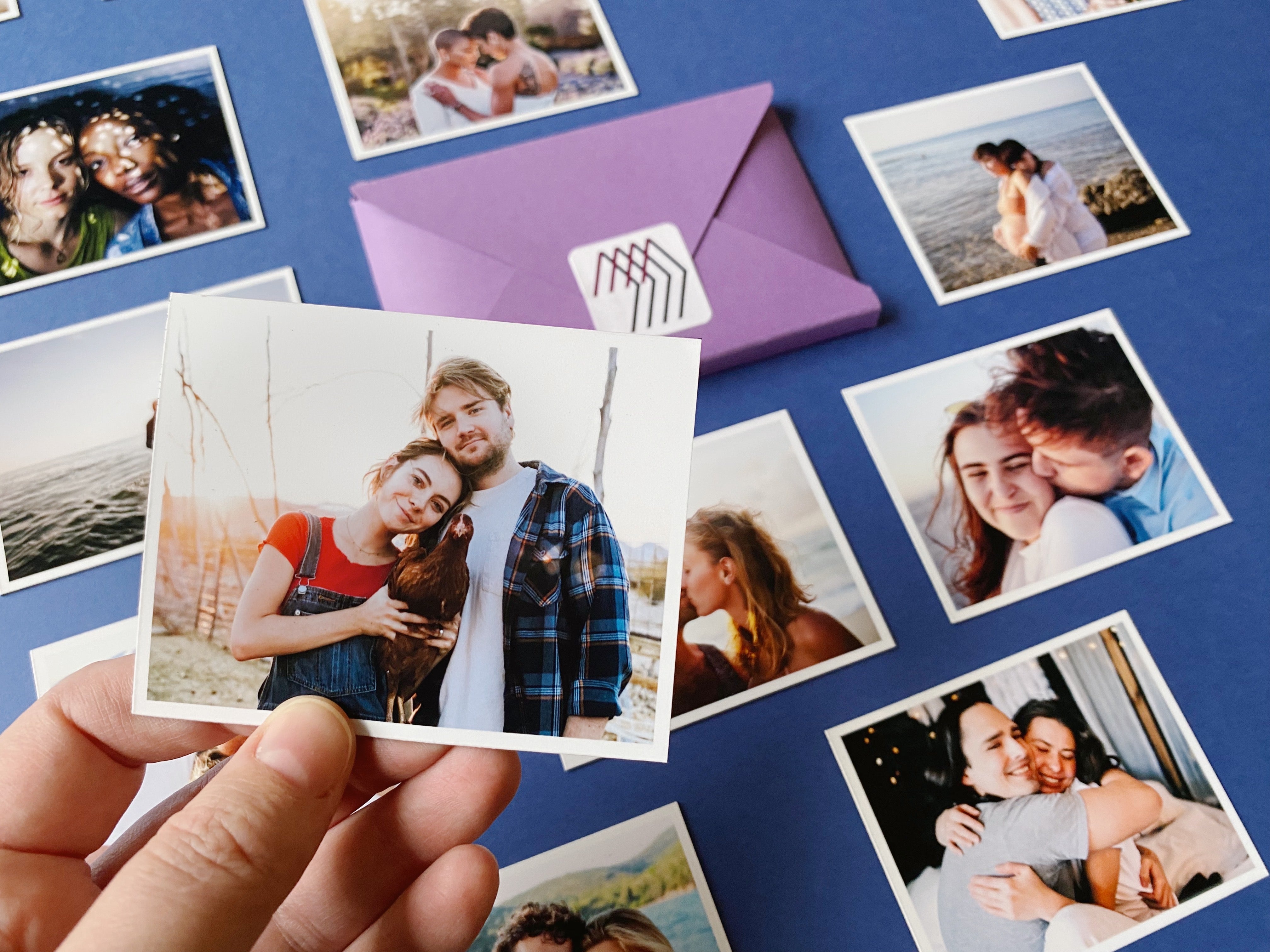 Custom photo magnets featuring couples and family portraits on a blue background with a Magnetic Love envelope.